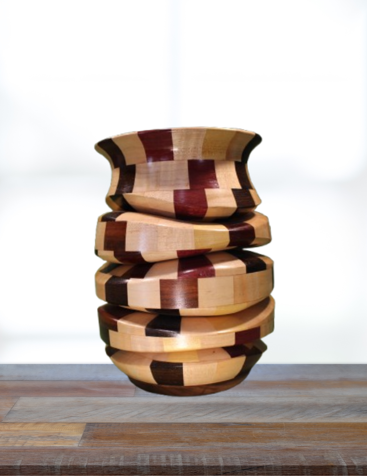 Wooden vase with checkered pattern on a wooden counter or desk.