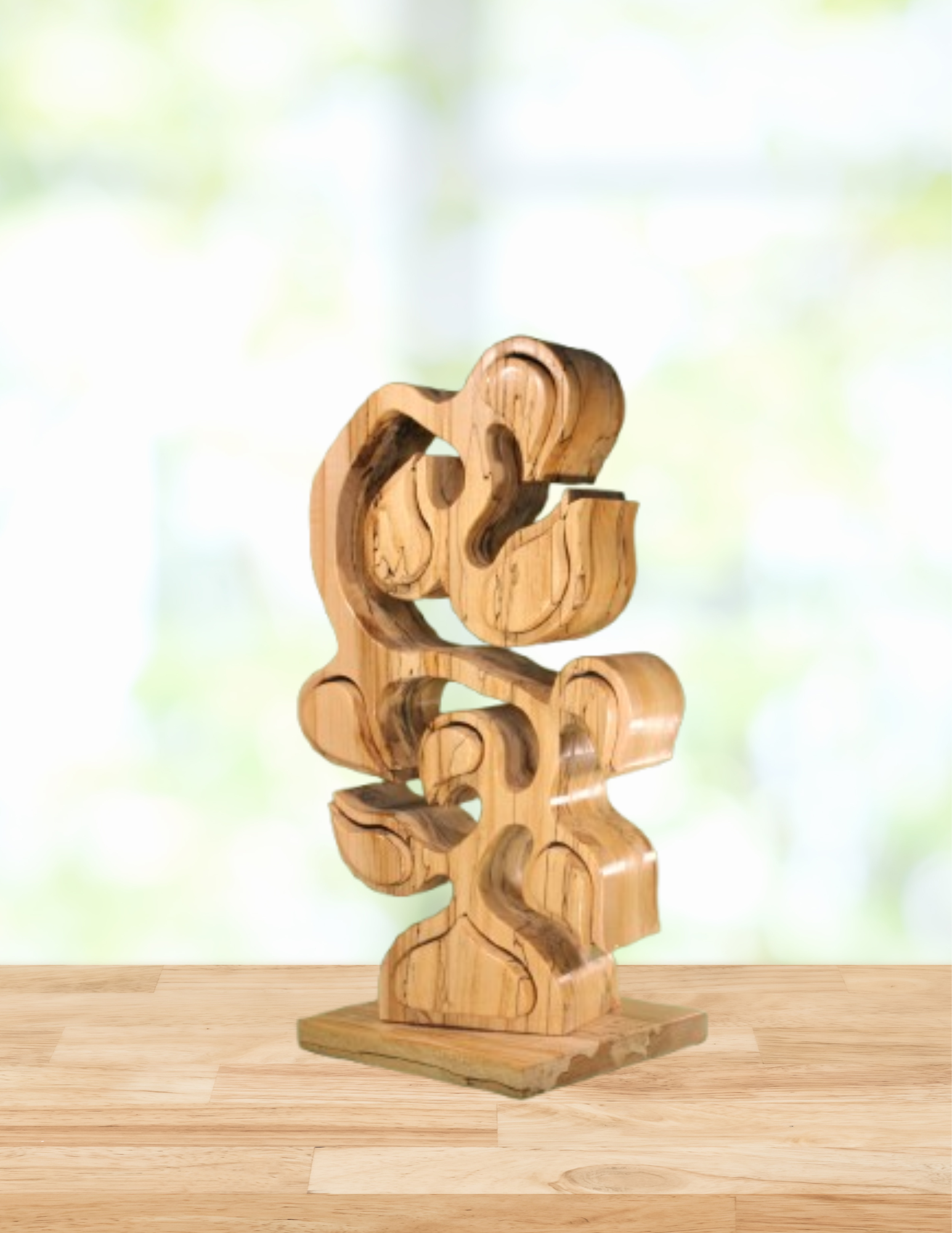 Wooden abstract sculpture on a wooden surface with a blurred light background