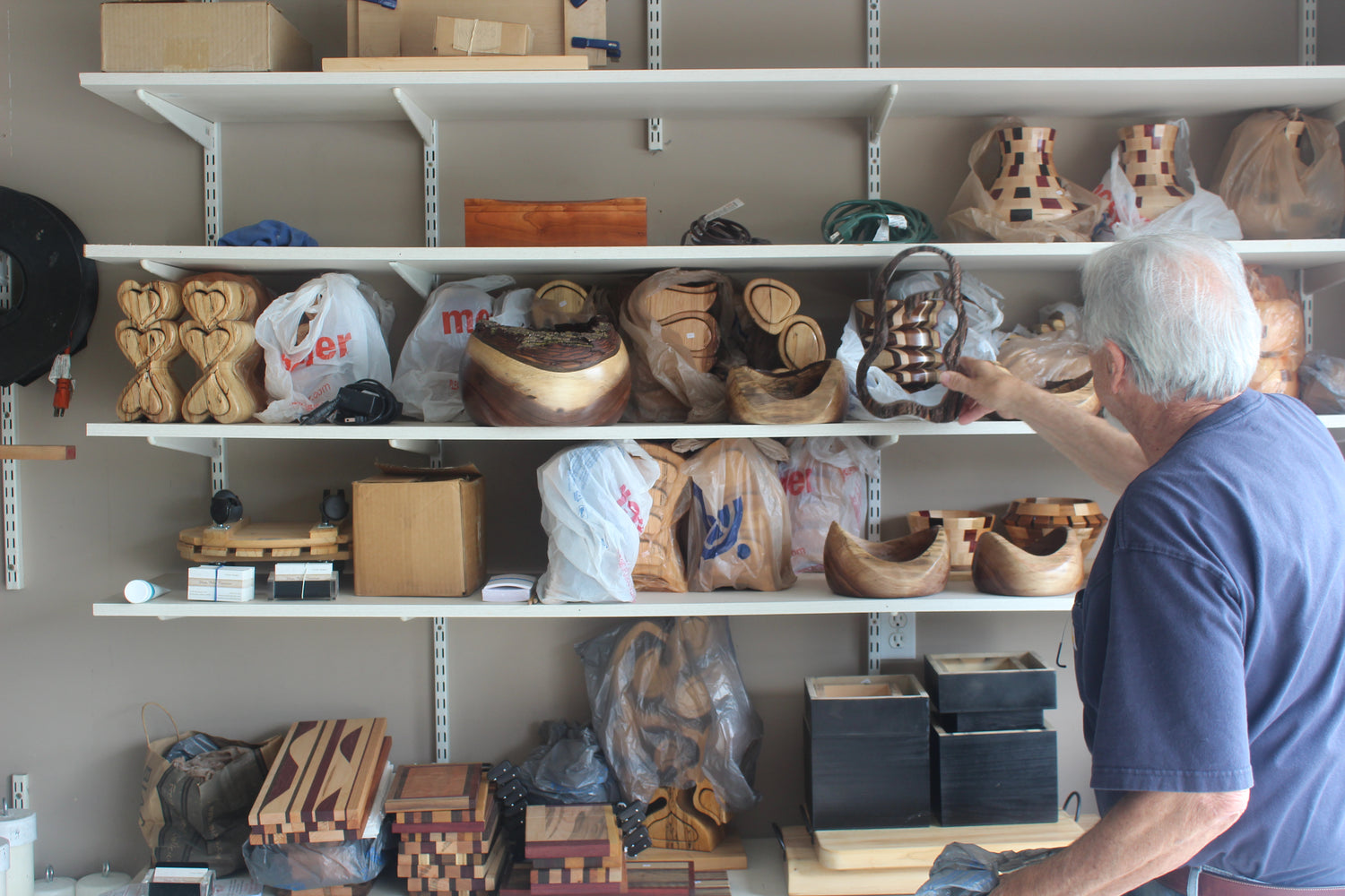 Thom Pabst looking at assortment of pieces to be shipped out. Fort Wayne, Indiana, United States.