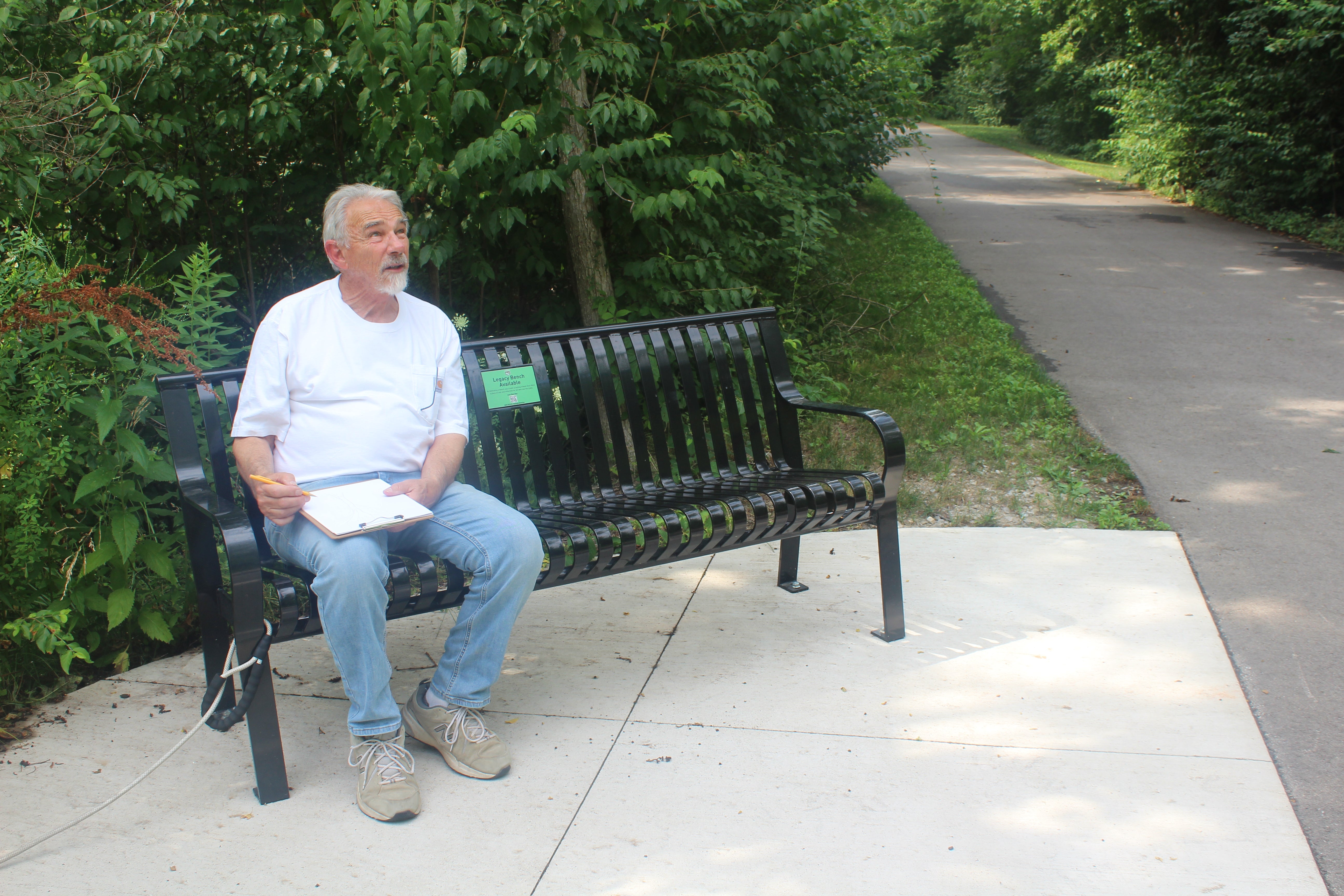 Thom Pabst sitting on a bench while thinking of how to make hand made wood working pieces